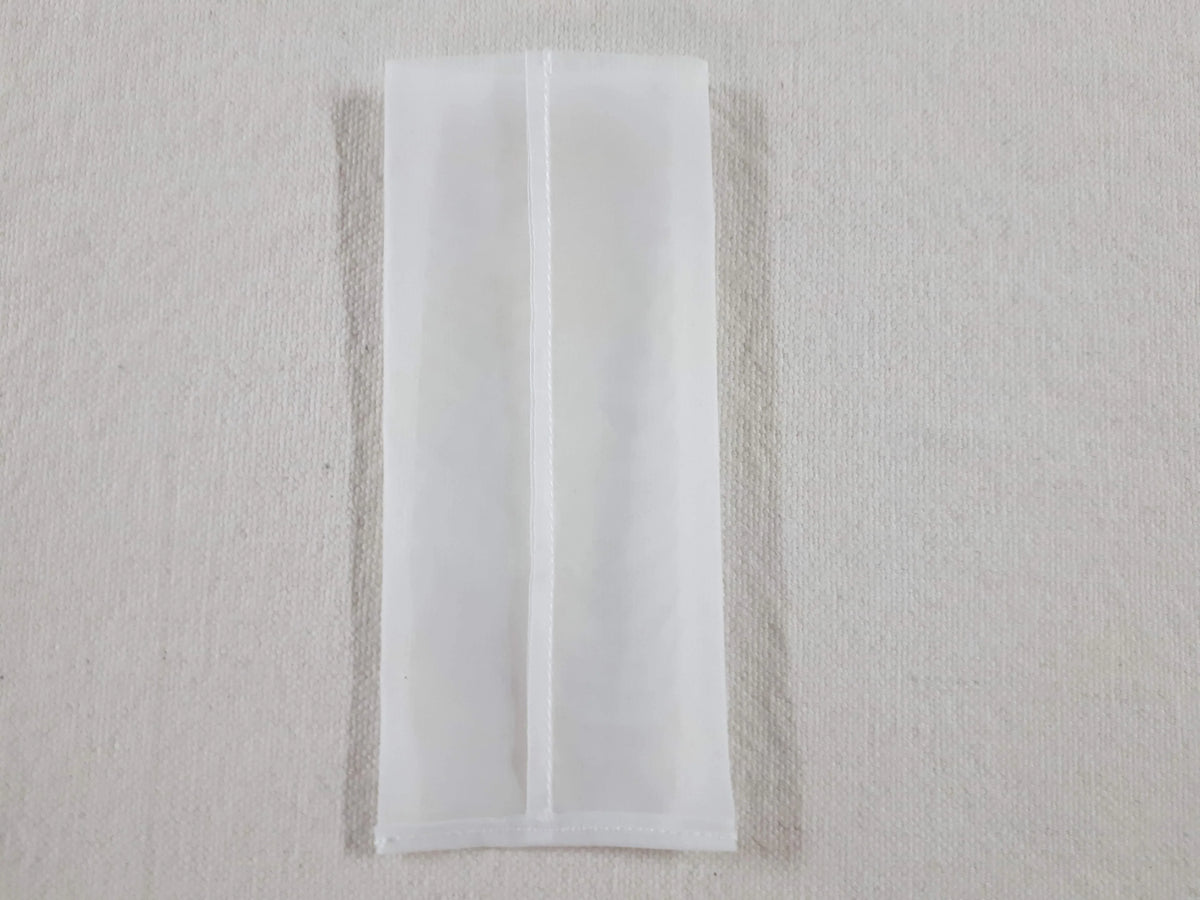 White mesh rosin press bag for botanical extraction.