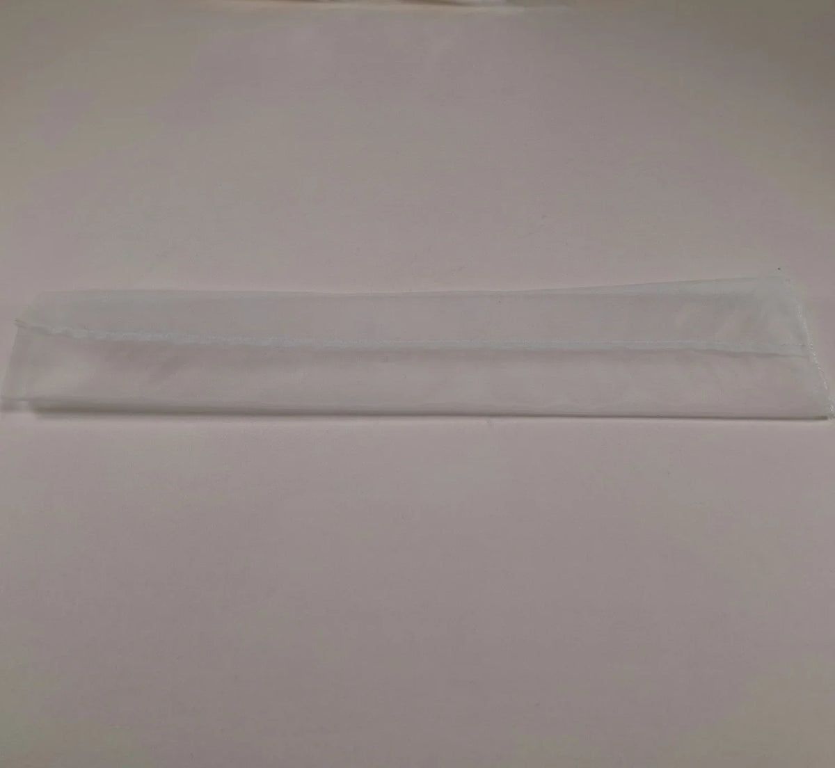 White fabric rosin press bag on a plain white background.
