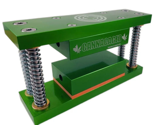 Green CannaCaged rosin press with heavy-duty metal springs and heated plates.