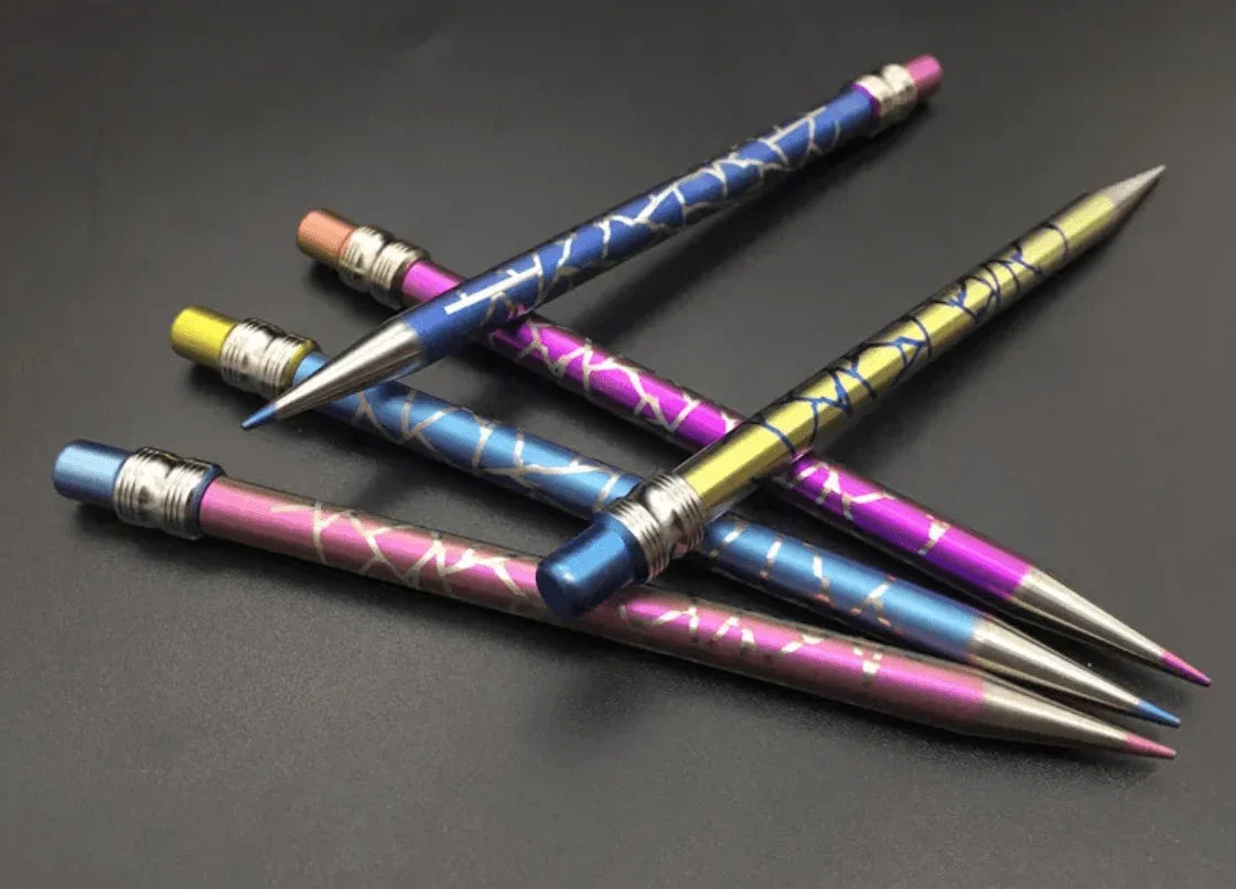 Assorted colorful metallic pens with geometric patterns on a dark background
