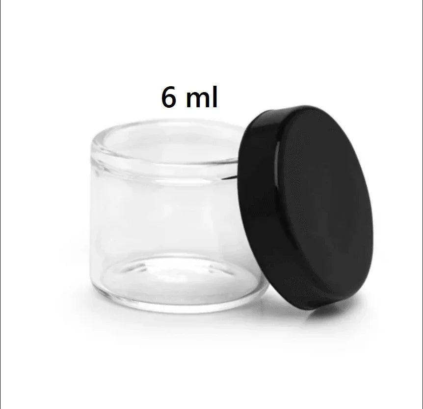 Small 6 ml clear glass storage jar with a black screw-top lid.