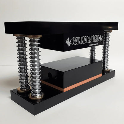 Cannacaged rosin press with black heated plates and heavy-duty steel springs.